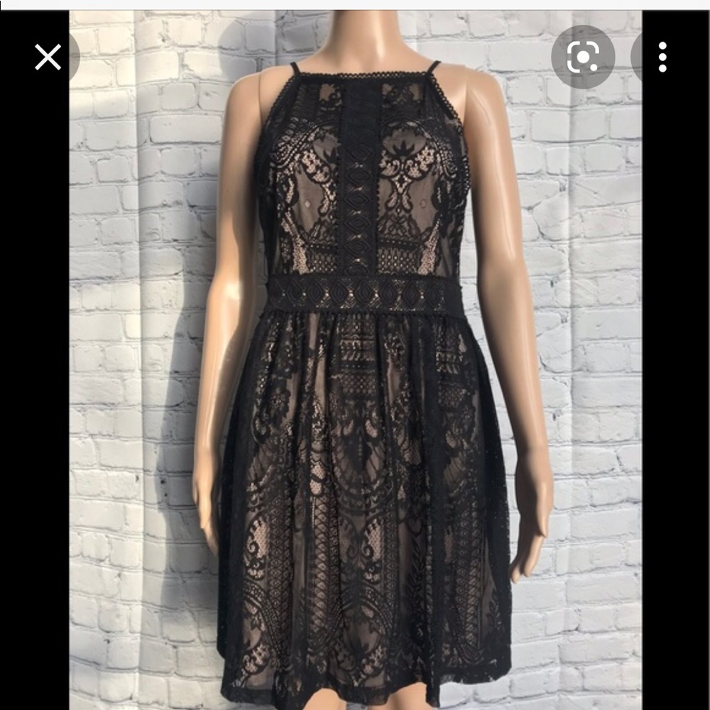 FRANCESCA’S Black lace dress with nude underlay. Size medium